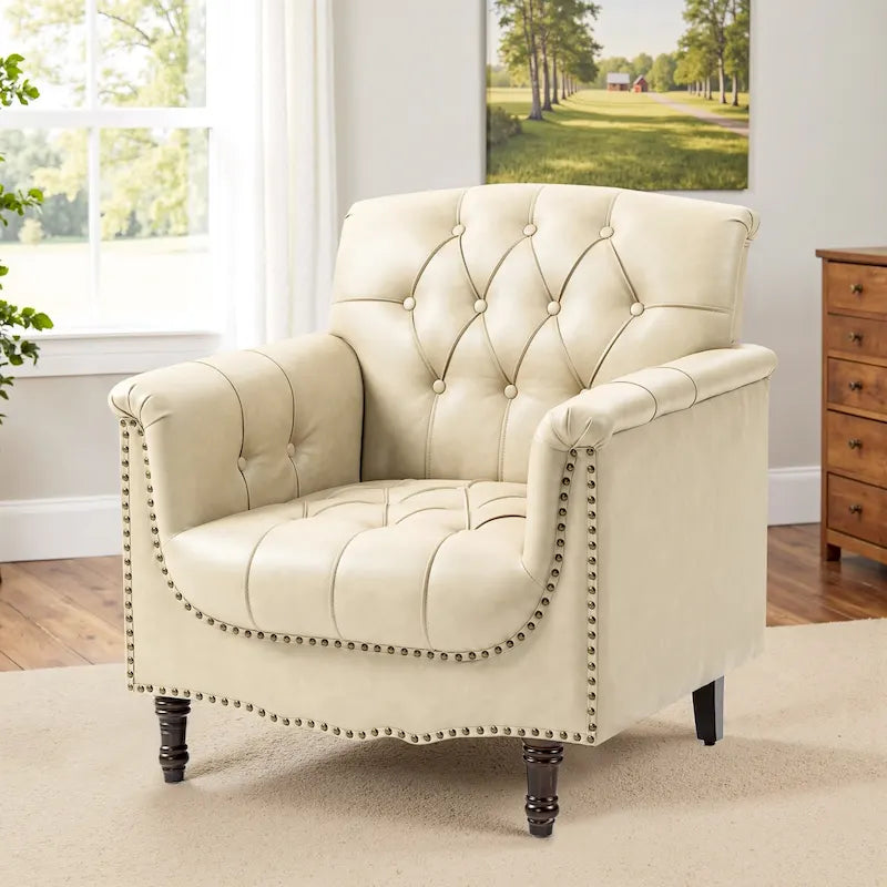 Fauteuil club en similicuir capitonné avec clous décoratifs et pieds tournés en bois