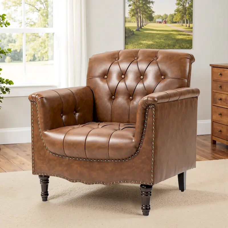 Fauteuil club en similicuir capitonné avec clous décoratifs et pieds tournés en bois