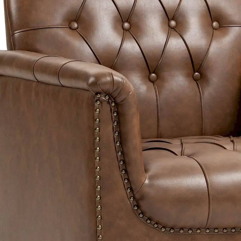 Fauteuil club en similicuir capitonné avec clous décoratifs et pieds tournés en bois