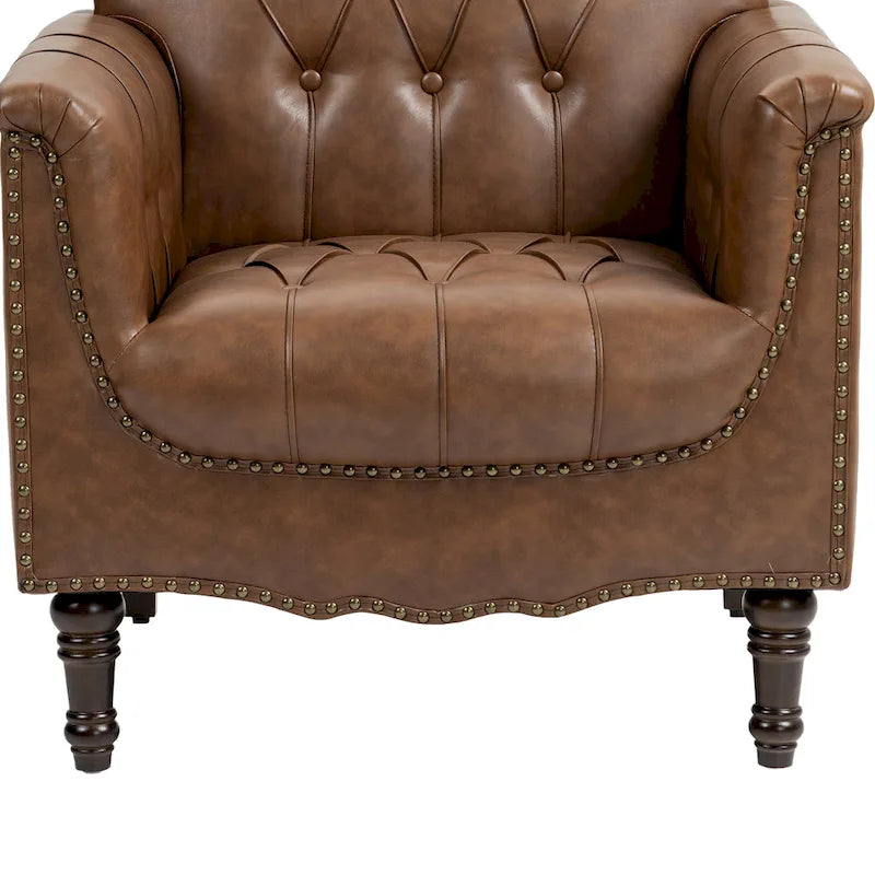 Fauteuil club en similicuir capitonné avec clous décoratifs et pieds tournés en bois