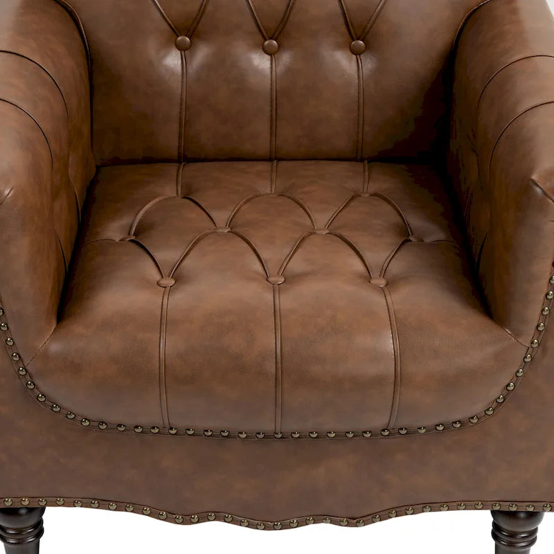 Fauteuil club en similicuir capitonné avec clous décoratifs et pieds tournés en bois