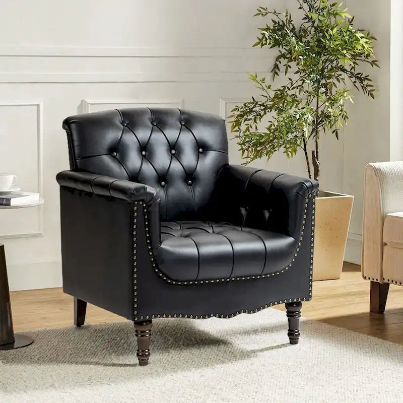 Fauteuil club en similicuir capitonné avec clous décoratifs et pieds tournés en bois