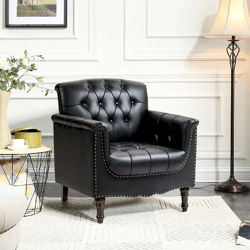 Fauteuil club en similicuir capitonné avec clous décoratifs et pieds tournés en bois